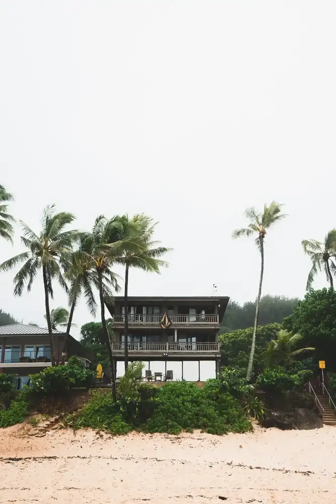 beachfront houses among palm trees at Pupukea on the North Shore